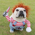 White bulldog in red-striped doll costume with wig and toy knife, on white